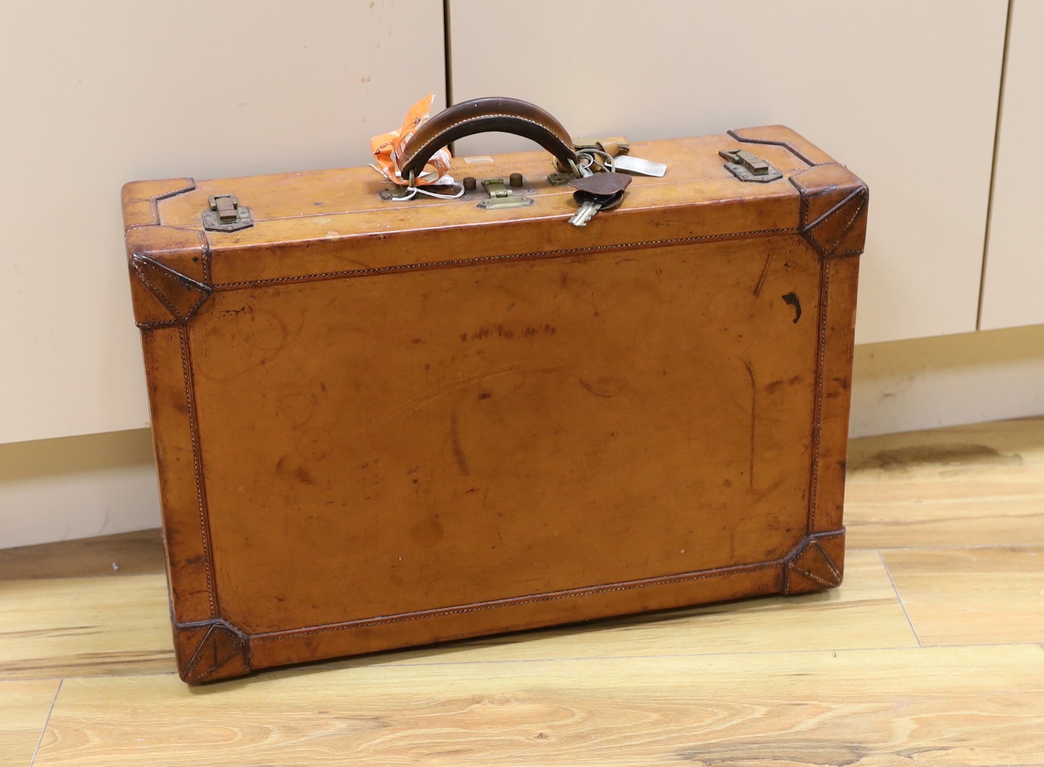 A brown leather suitcase